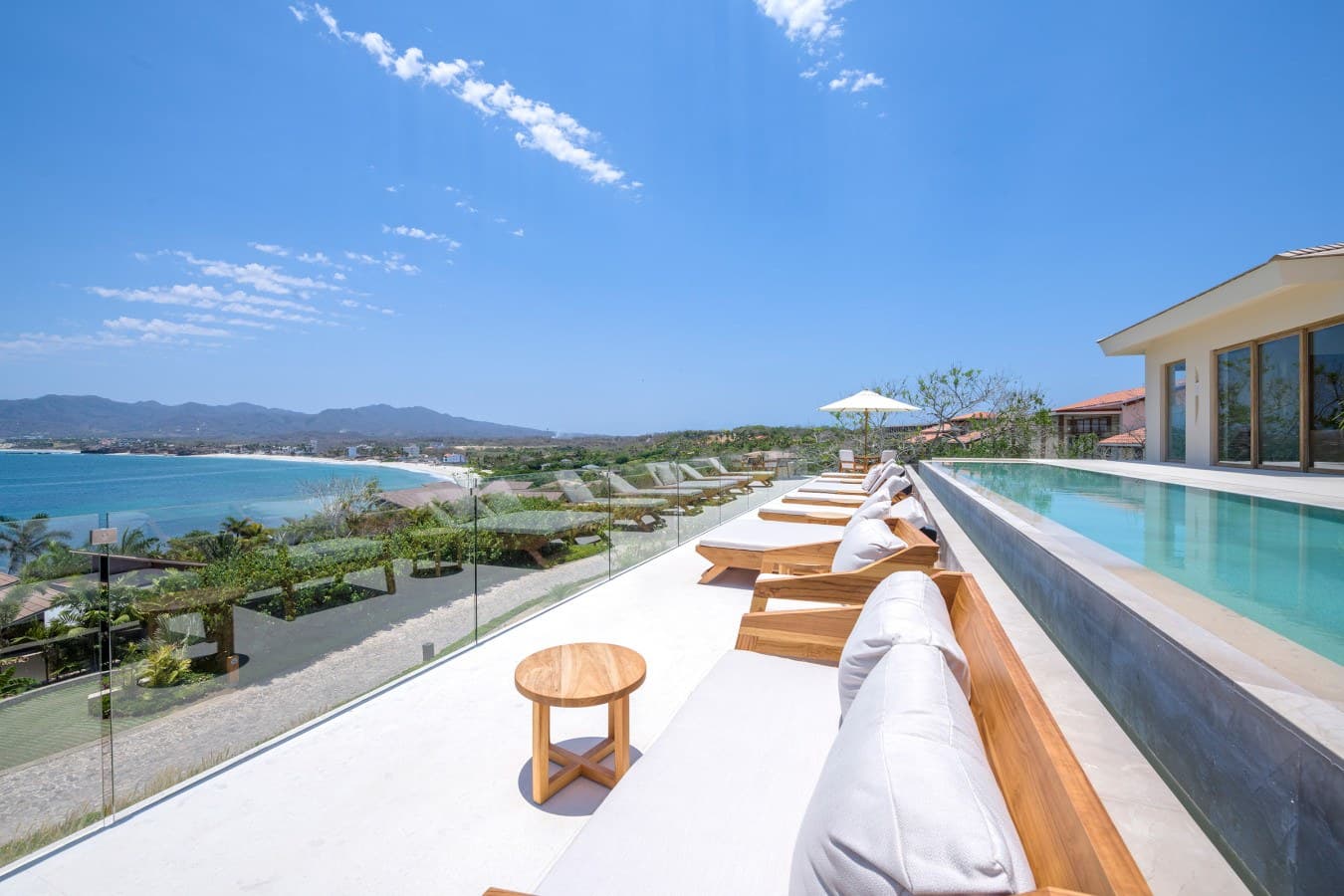 Stunning beachfront paradise where you can lounge poolside, soak up panoramic coastal views, and let the gentle ocean breeze melt your worries away.