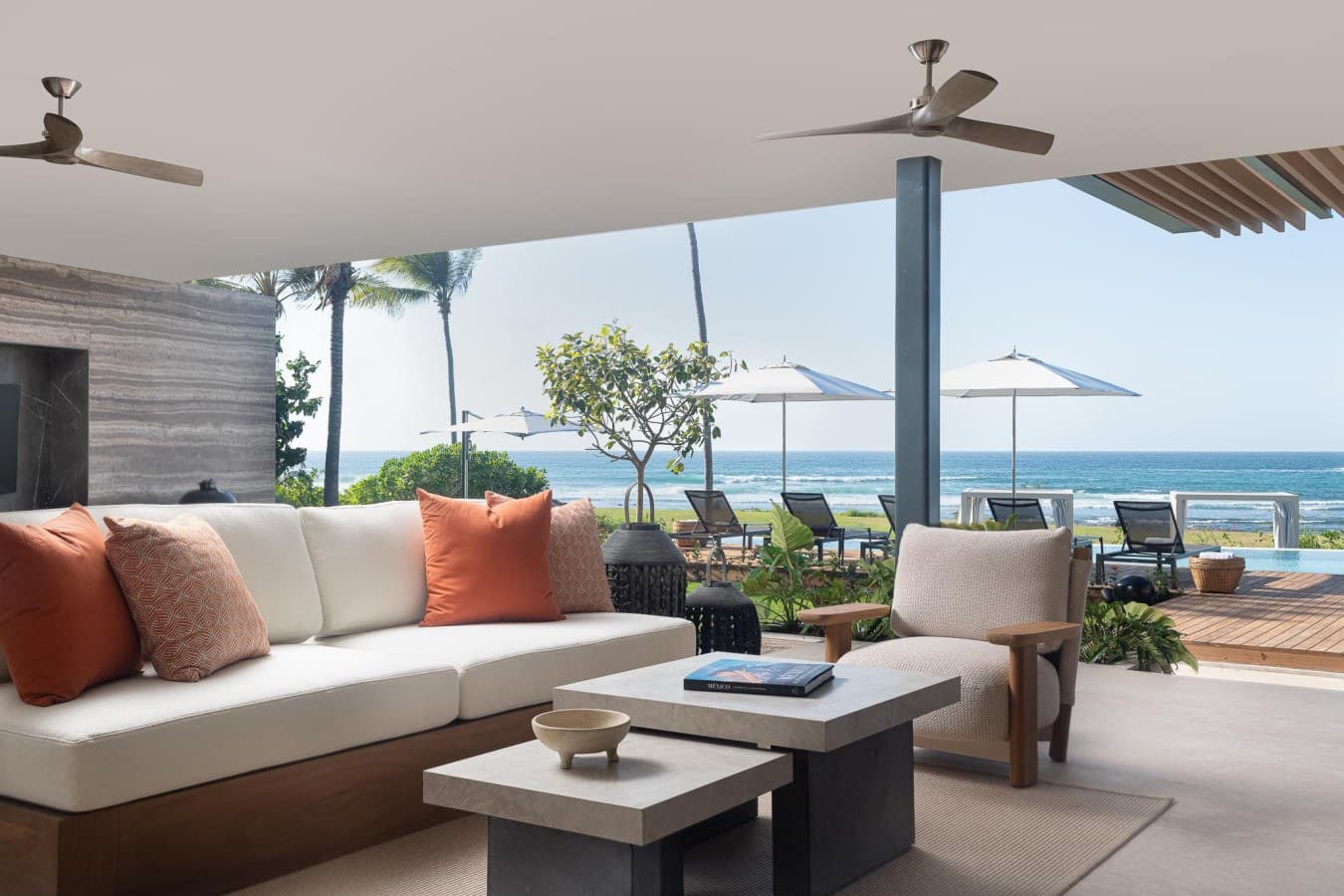 Unwind in your oceanfront lounge, where plush seating and panoramic views create your perfect escape. The gentle sea breeze and endless horizon make every moment feel like paradise.