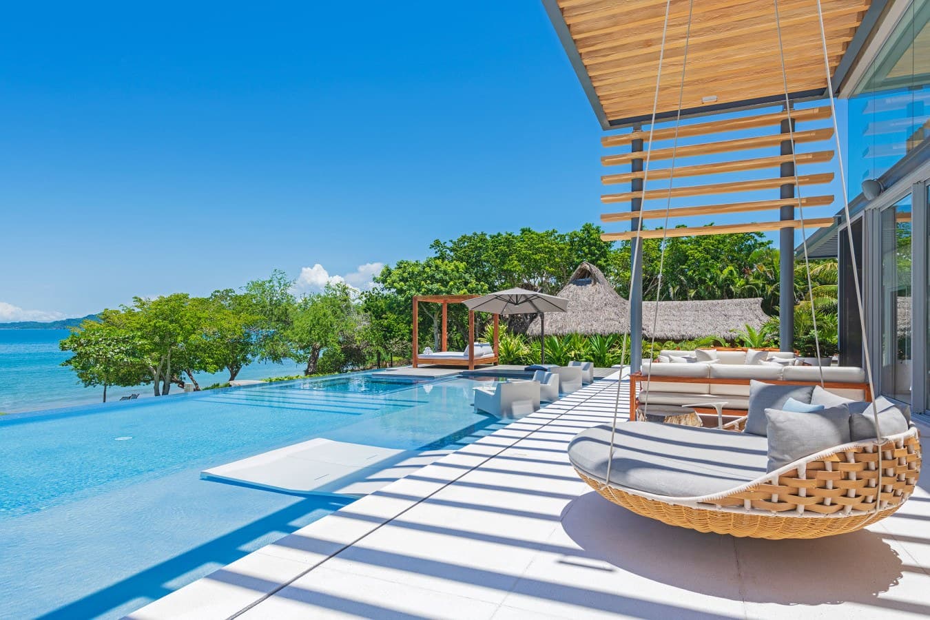 Slip into these suspended loungers and soak up uninterrupted views of turquoise water merging with tropical greenery. Your infinity pool, your private oceanfront paradise—every day feels like an escape here.