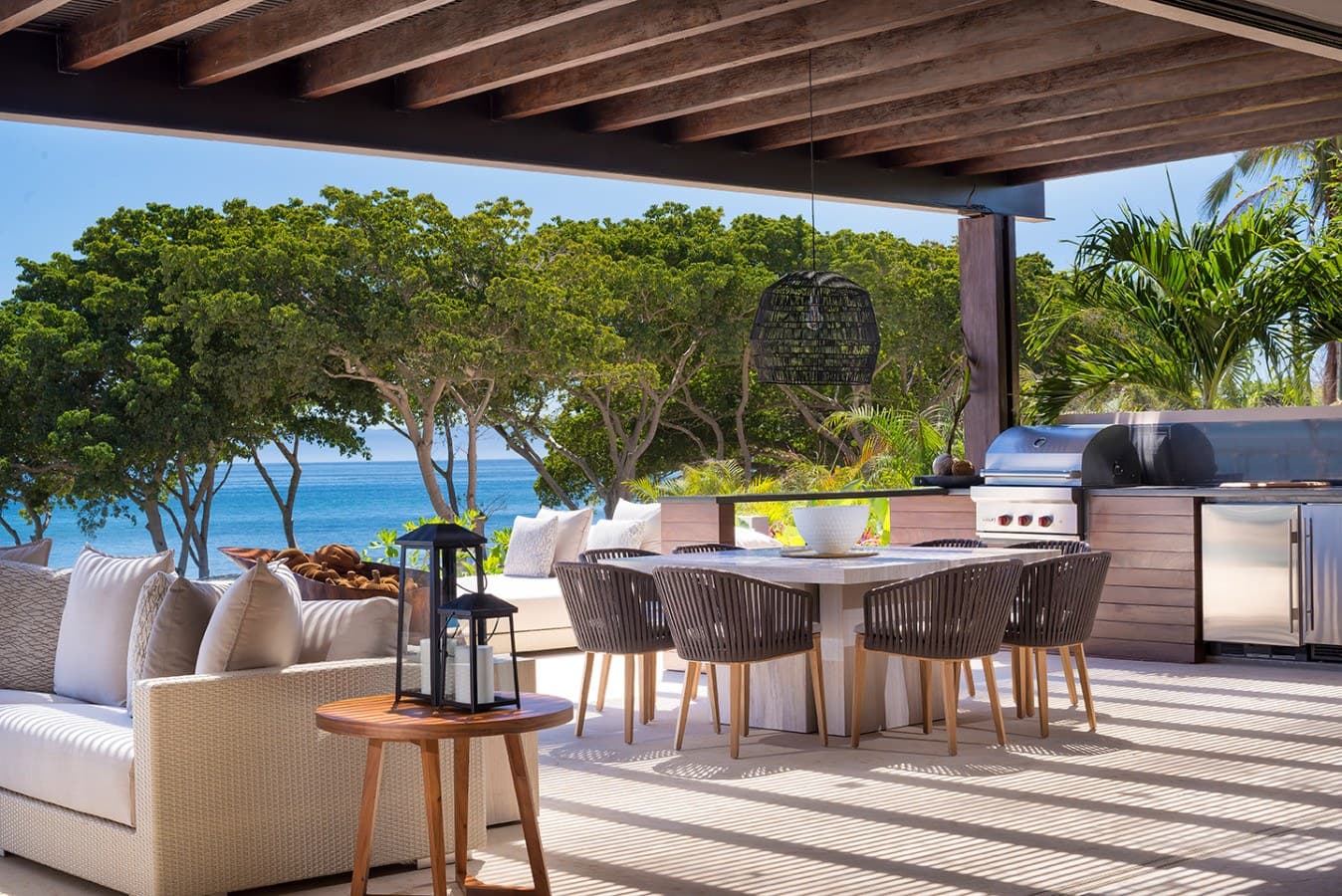 Your private oceanfront terrace invites you to dine al fresco with turquoise waters and swaying palms just steps away—perfect for grilling fresh catches while tropical breezes drift through.