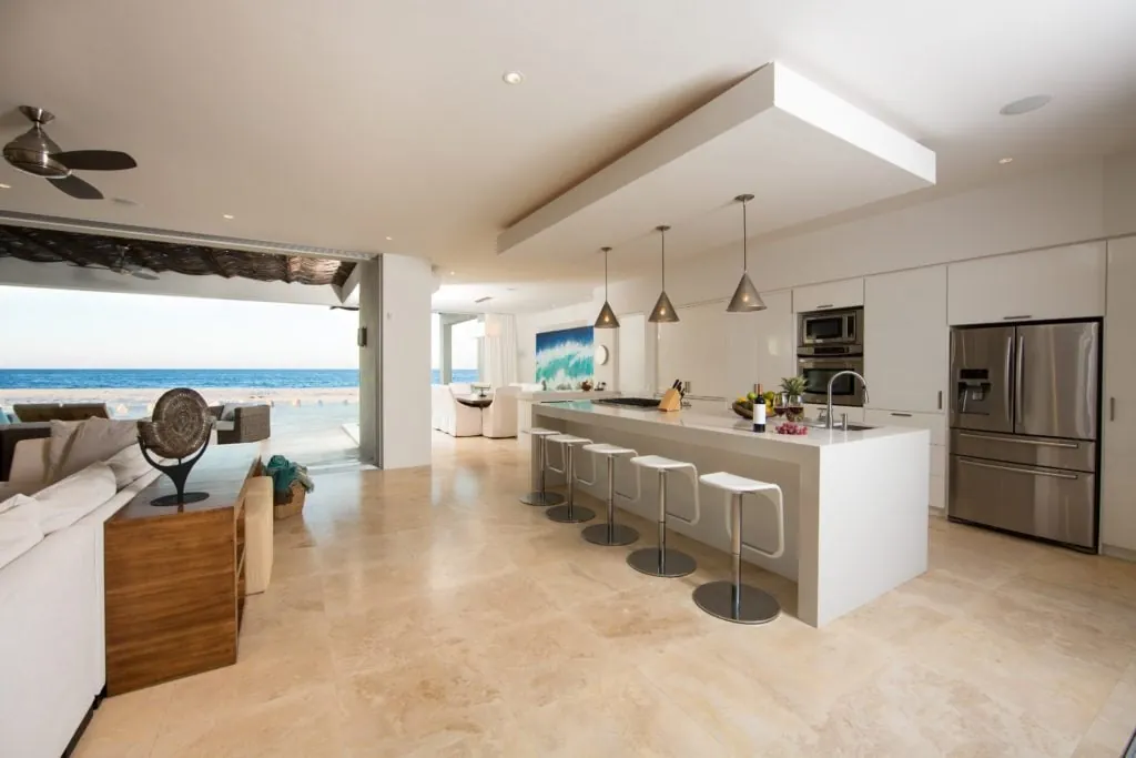 A view of the kitchen and its bar seating.