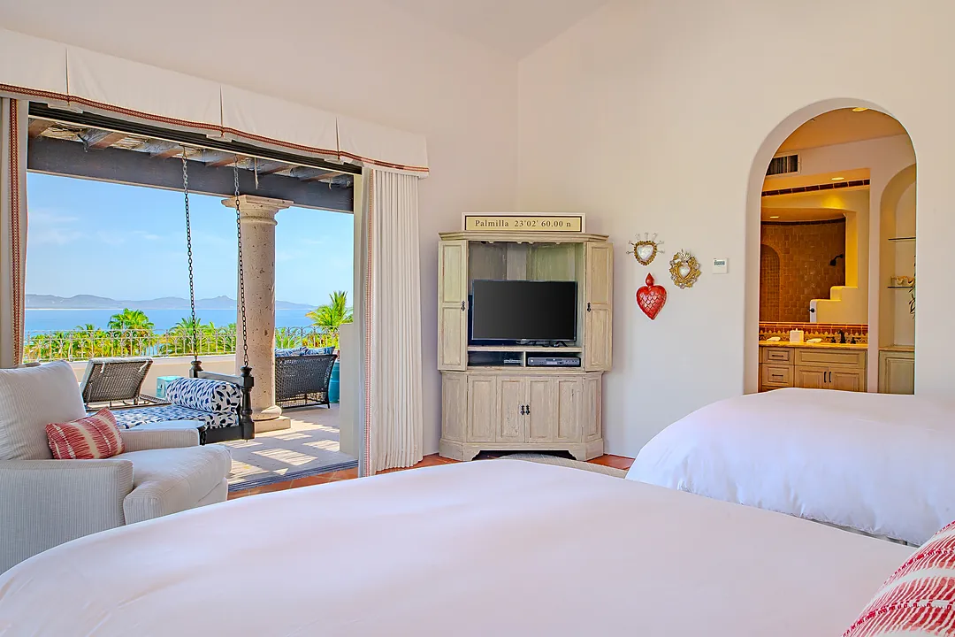 Unwind poolside in your private oasis, where turquoise loungers, a sparkling infinity pool, and a hot tub meet lush tropical gardens and ocean views beyond.