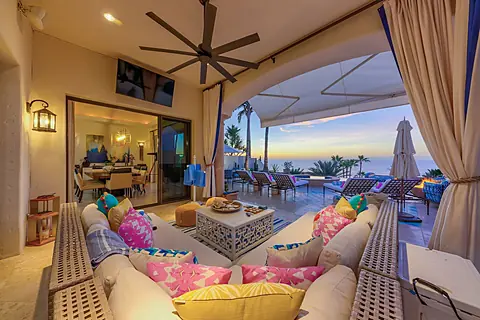 View of the open seating area next to the dining room with open access to the pool and patio.