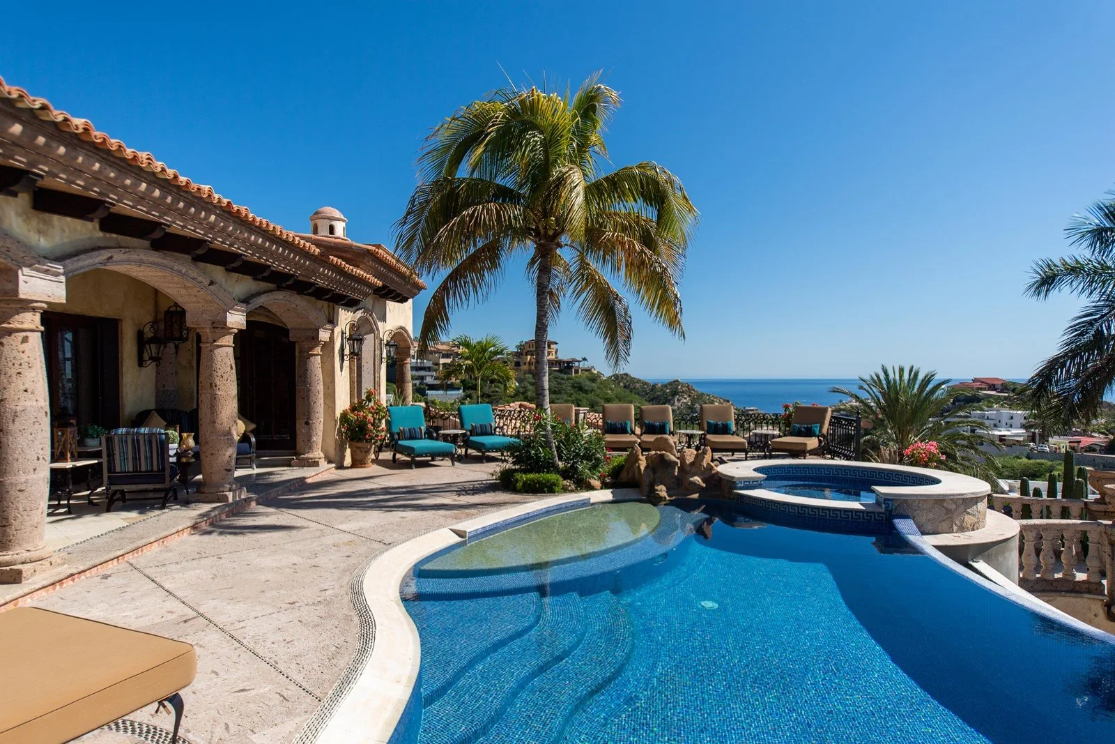 Daytime view of the pool and patio of Villa Maria.