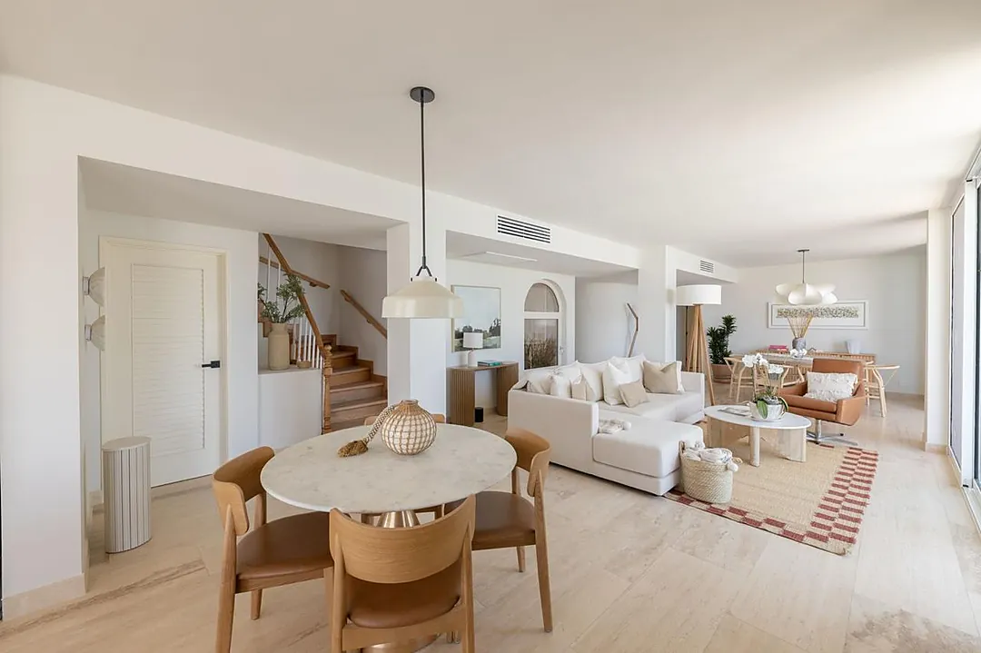 Step into a spacious open-concept retreat where natural light and warm wood tones blend effortlessly. Your living, dining, and relaxation zones flow together, inviting you to unwind in comfort.