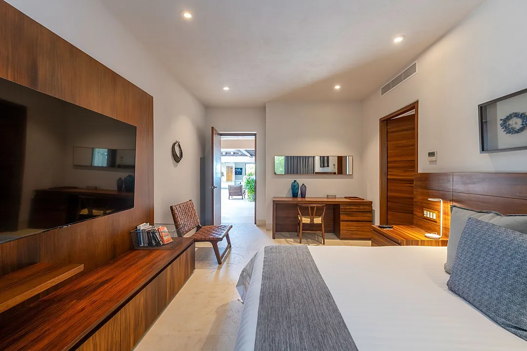 Bedroom 4 · Your modern sanctuary blends warm wood tones with sleek white finishes, creating a spacious retreat where you can unwind in comfort and style.