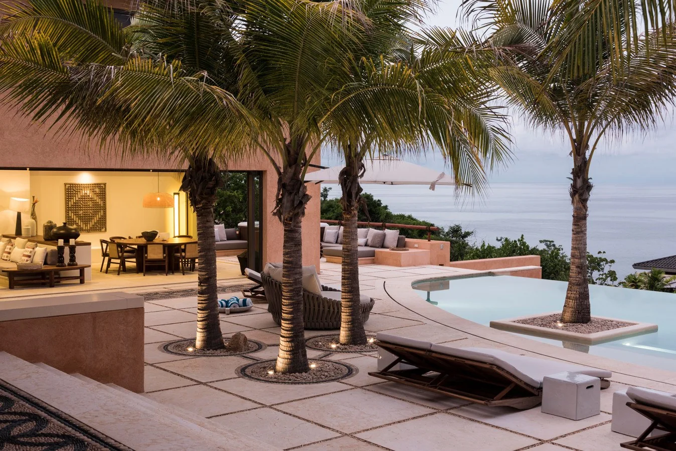 Sink into your poolside lounge chair and soak in the tranquil ocean views—your own slice of coastal paradise awaits.