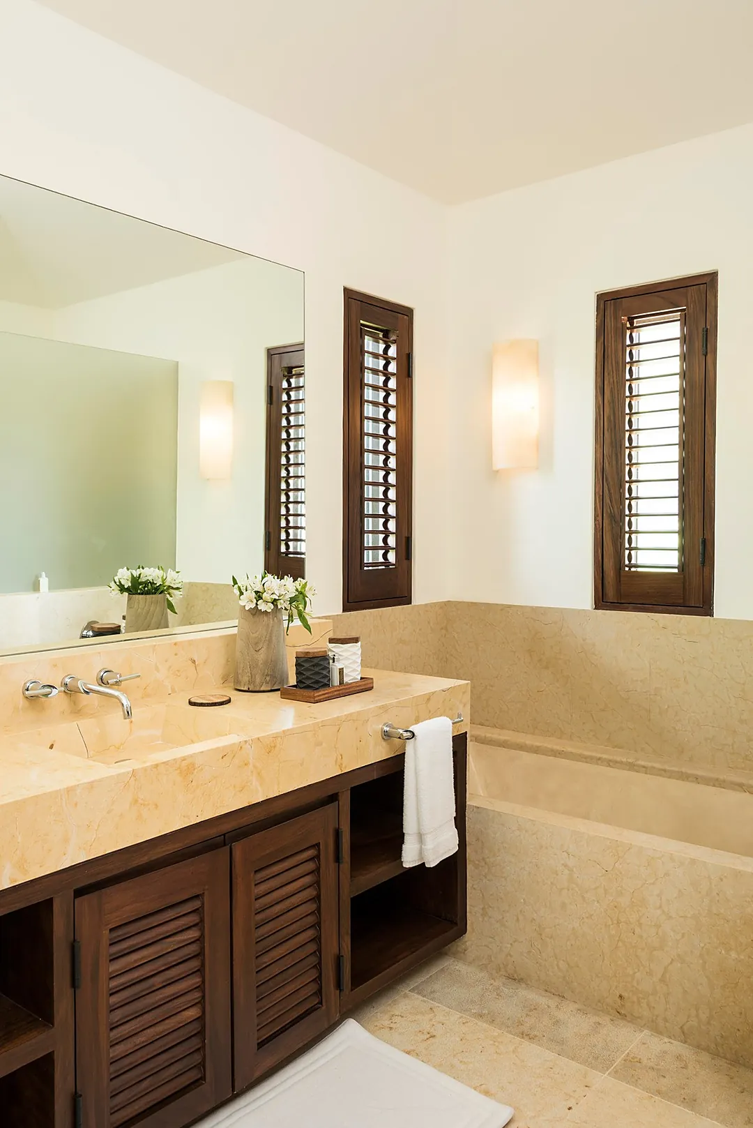 Bathroom 3 · Slip into the warm stone tub and let vacation truly begin. Your elegant bathroom feels like a private spa, with soft lighting and natural details creating your perfect retreat.