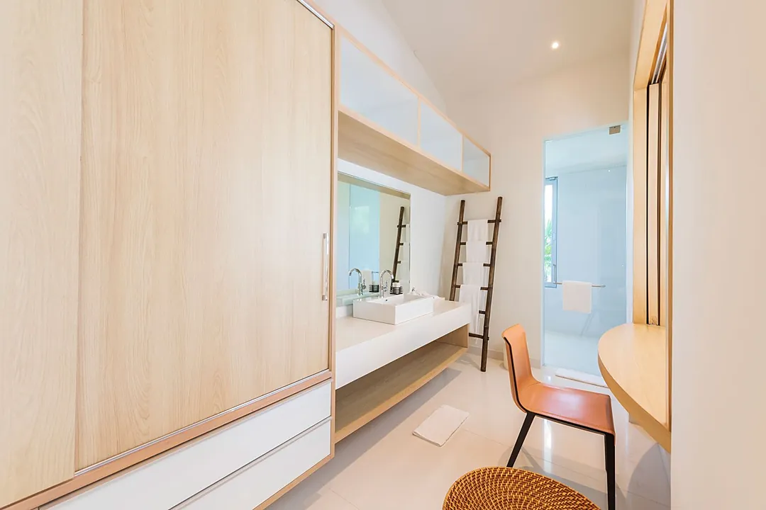 Bathroom 2 · Step into your modern, light-filled bathroom where clean lines and natural wood create a spa-like retreat. Towel ladders add charm while abundant storage keeps your essentials tucked away.