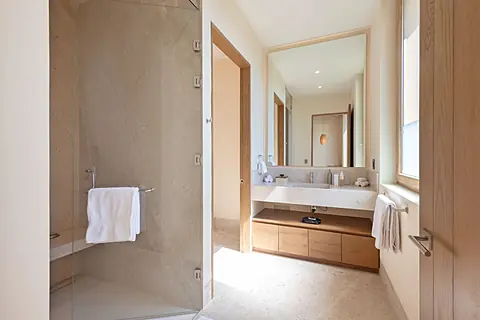 Bathroom 4 · Step into your spa-like bathroom with dual vanities, elegant marble surfaces, and a spacious walk-in shower where relaxation comes naturally.