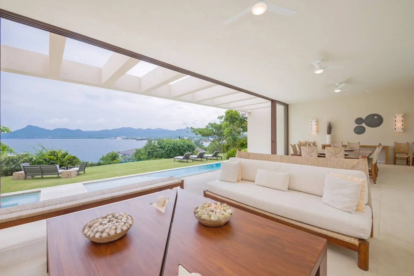Sink into your private terrace chairs and take in the stunning water and mountain views stretching to the horizon—your perfect retreat to unwind and reconnect with nature.