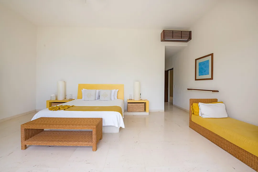 Sink into plush seating and drink in sweeping water and mountain vistas through floor-to-ceiling glass. Your serene indoor-outdoor sanctuary flows seamlessly to lush gardens and pool.