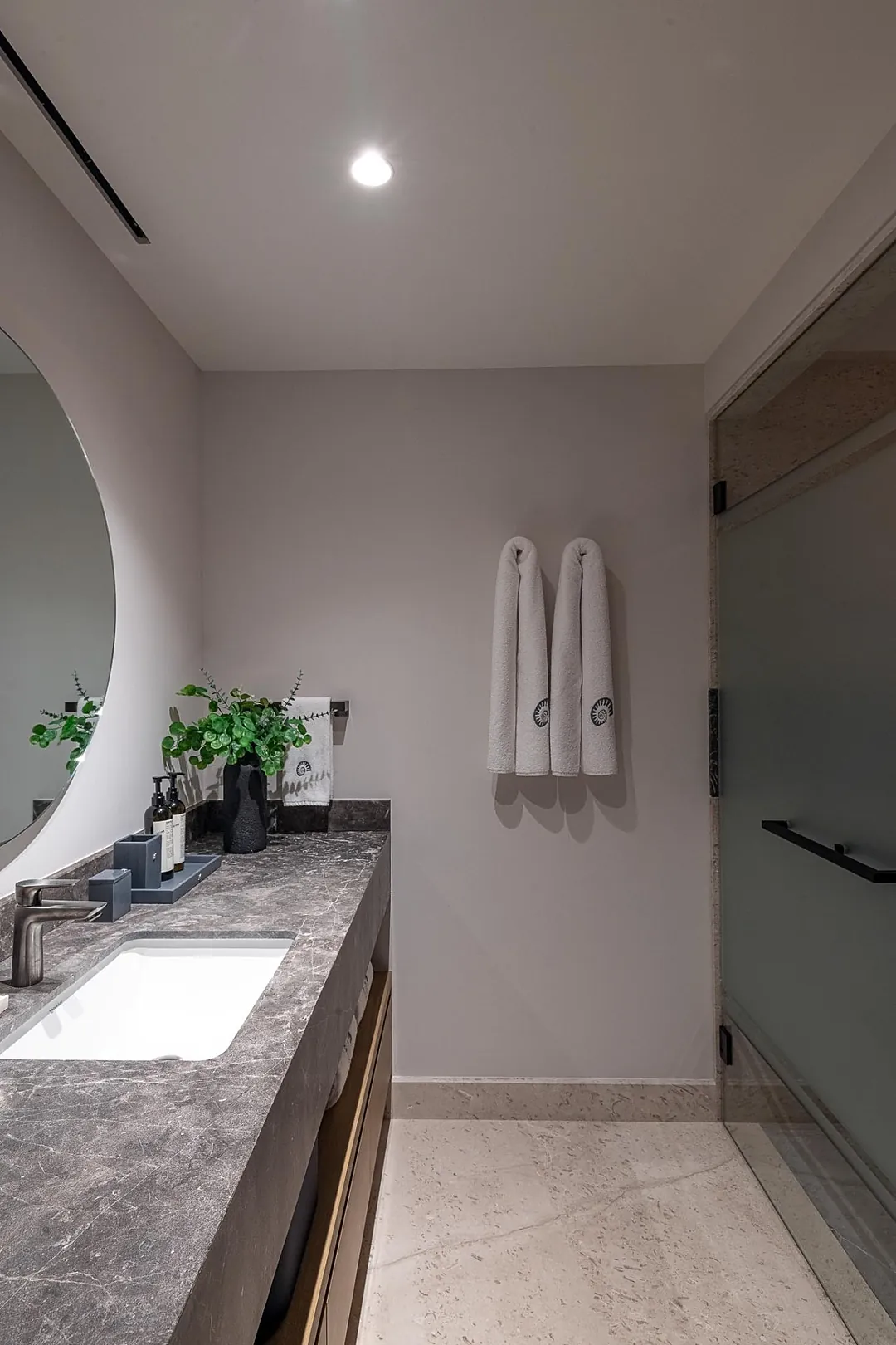 Bathroom 2 · Relax into your private retreat with elegant stone countertops, fresh towels awaiting, and a calming neutral palette that makes you feel instantly at home.