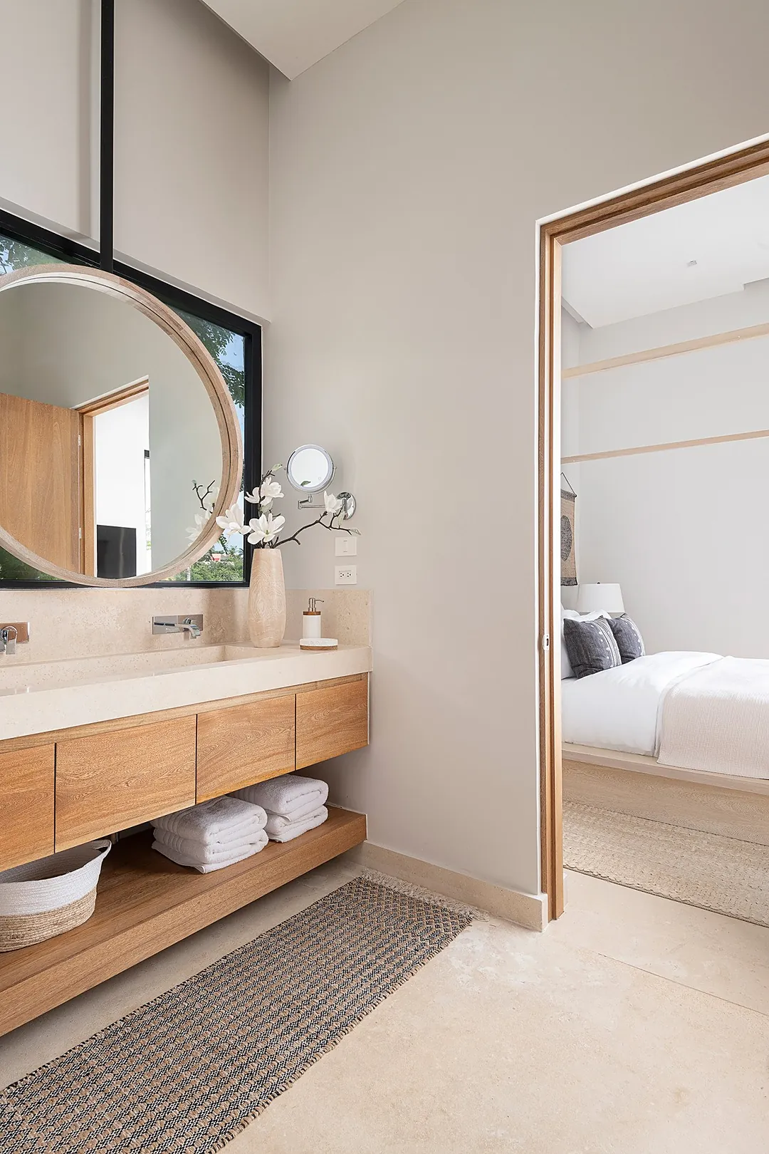 Bathroom 6 · Step into your serene ensuite where warm wood tones and soft neutral shades create a spa-like retreat. Fresh towels await on the open shelf below the floating vanity.