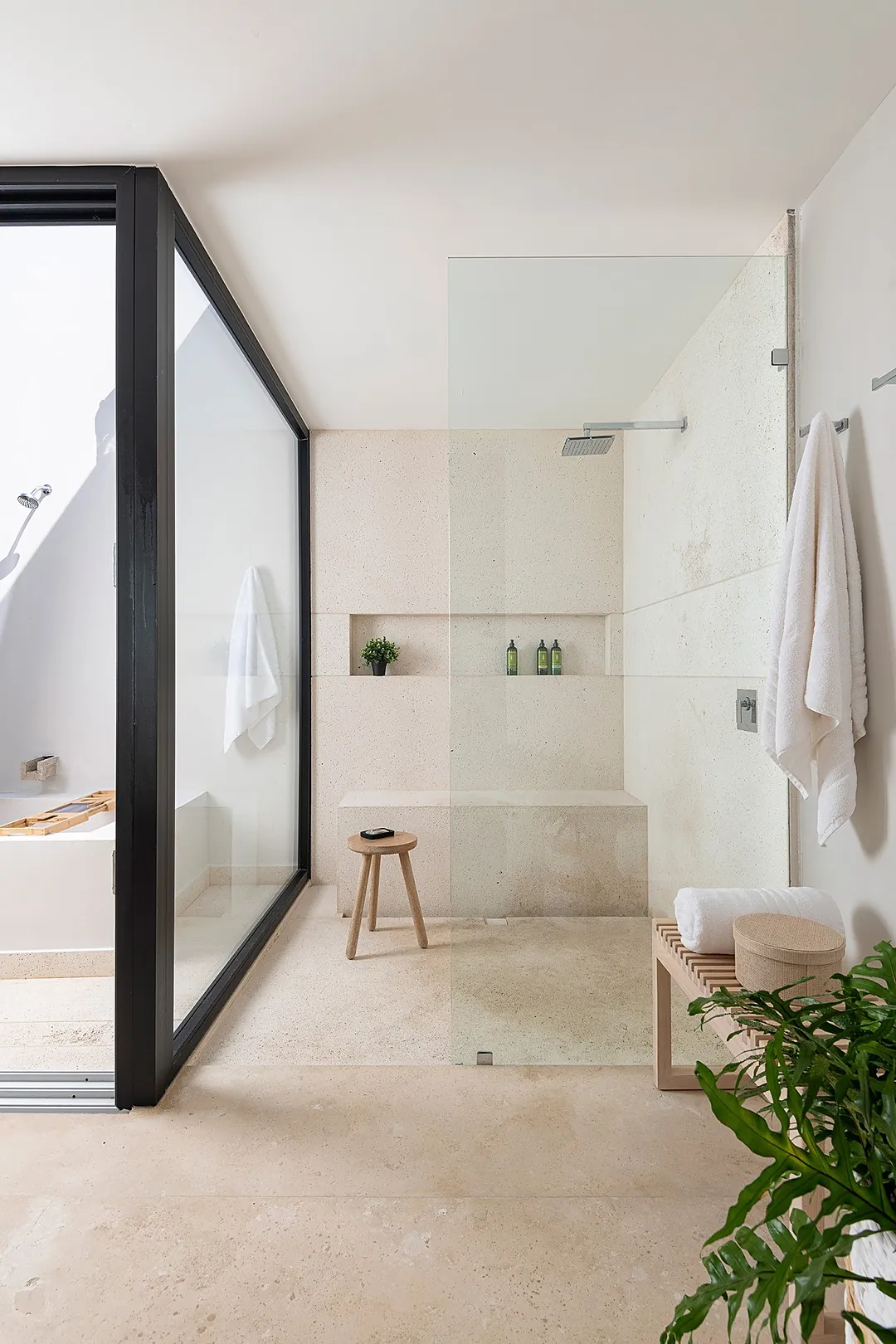 Bathroom 2 · Step into your private spa-like retreat, where natural light floods the spacious walk-in shower. A built-in bench and niche keep your essentials within reach while you unwind.