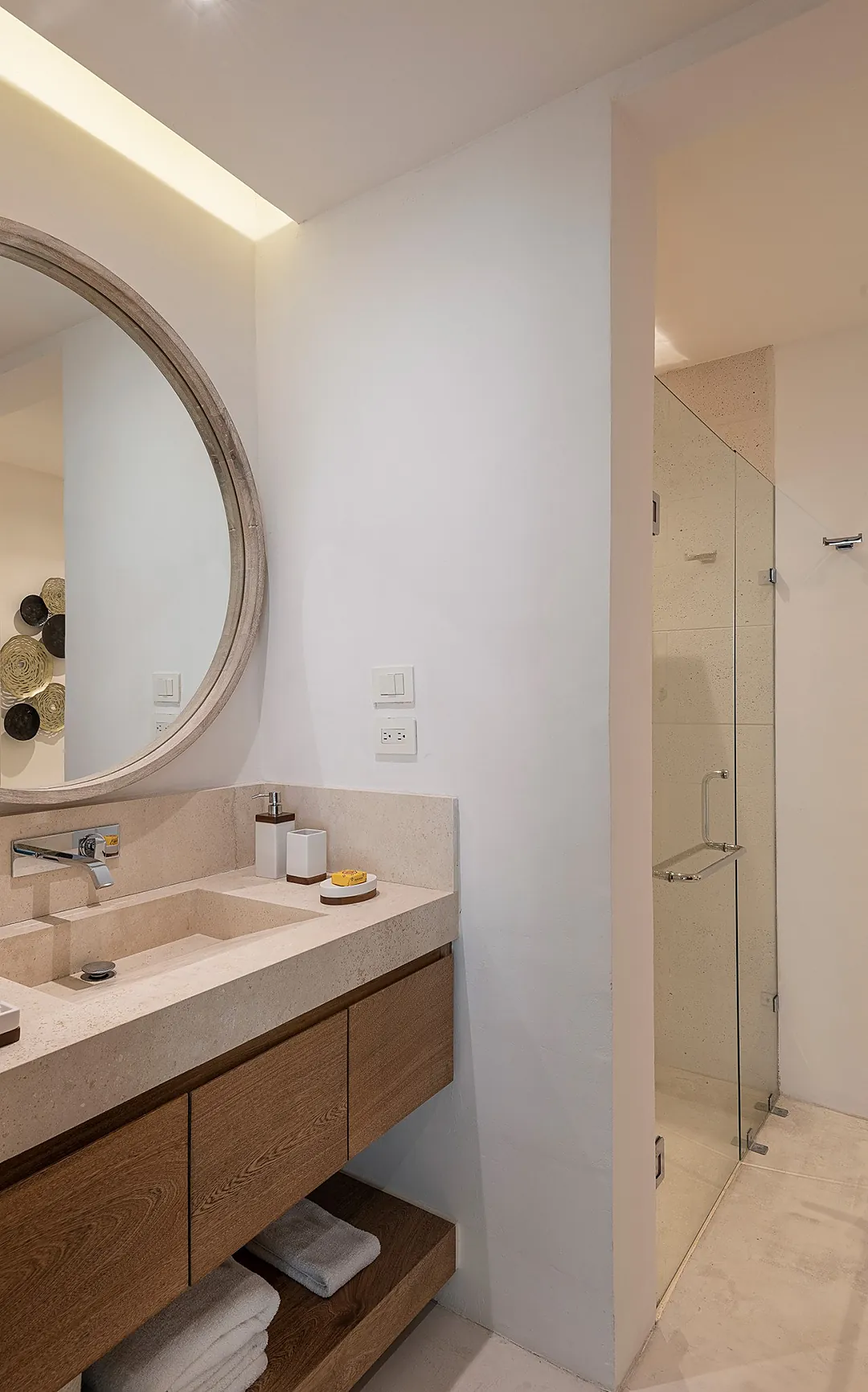 Bathroom 7 · Step into your beautifully appointed bathroom, where warm wood vanity meets elegant stone surfaces. Soft indirect lighting creates a spa-like ambiance as you prepare for the day ahead.