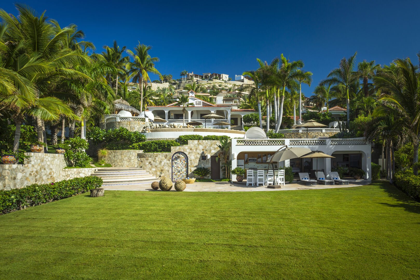 The green front lawn of a Palmilla Vacation Rental