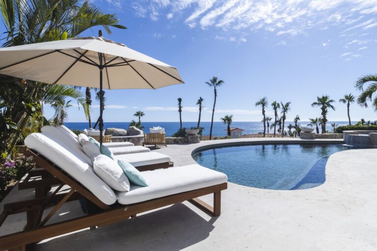 Patio furniture by the pool on your stay in Cabo San Lucas