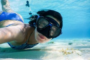 A woman underwater snorkeling