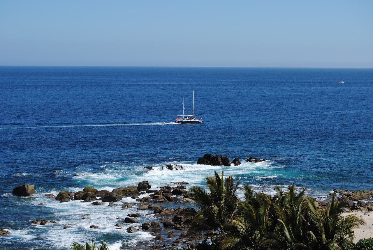 A sailboat on the summer waters of Cabo San Lucas