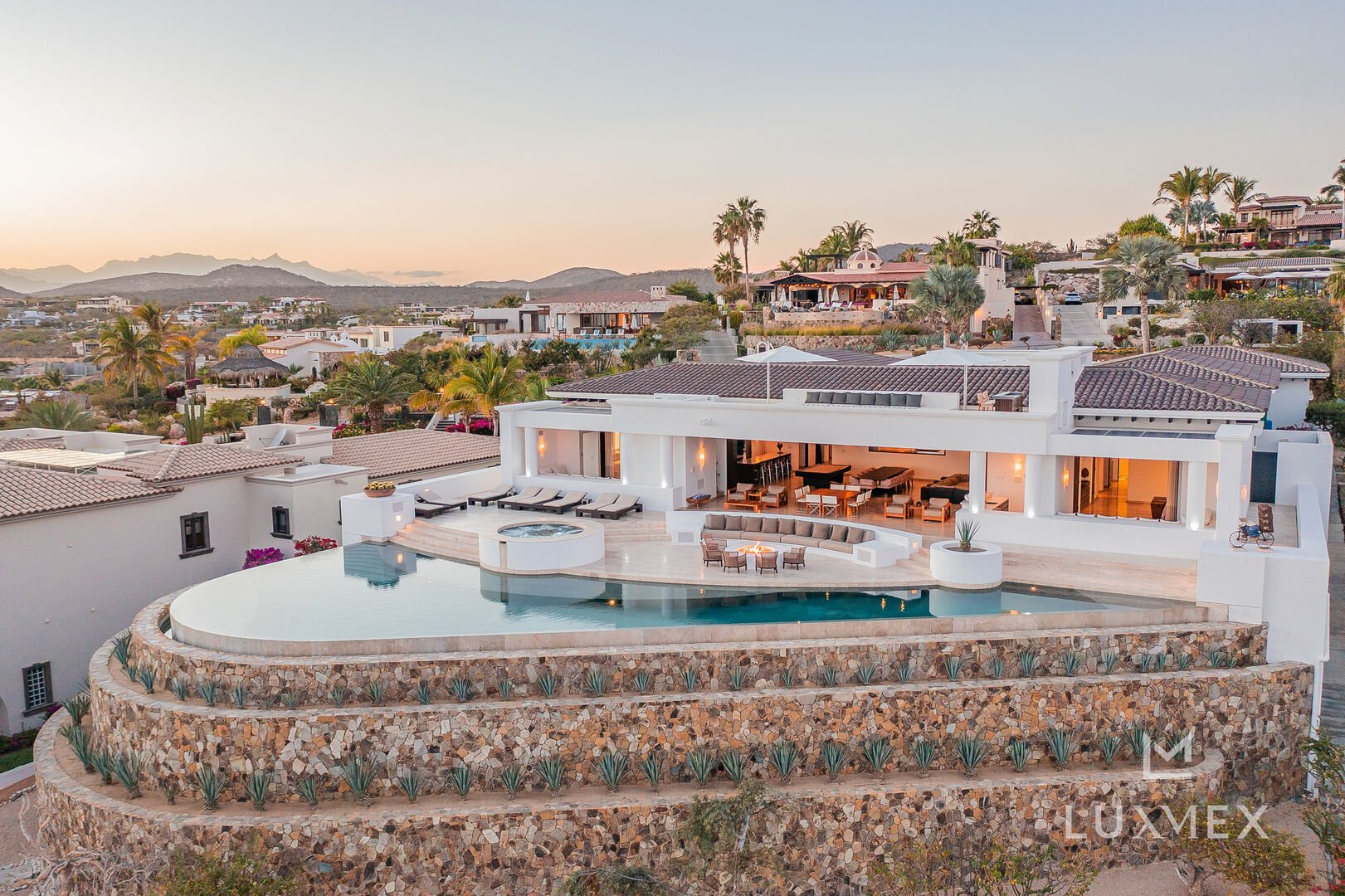 A distant aerial view of a Puerto Los Cabos Villa and it's large pool
